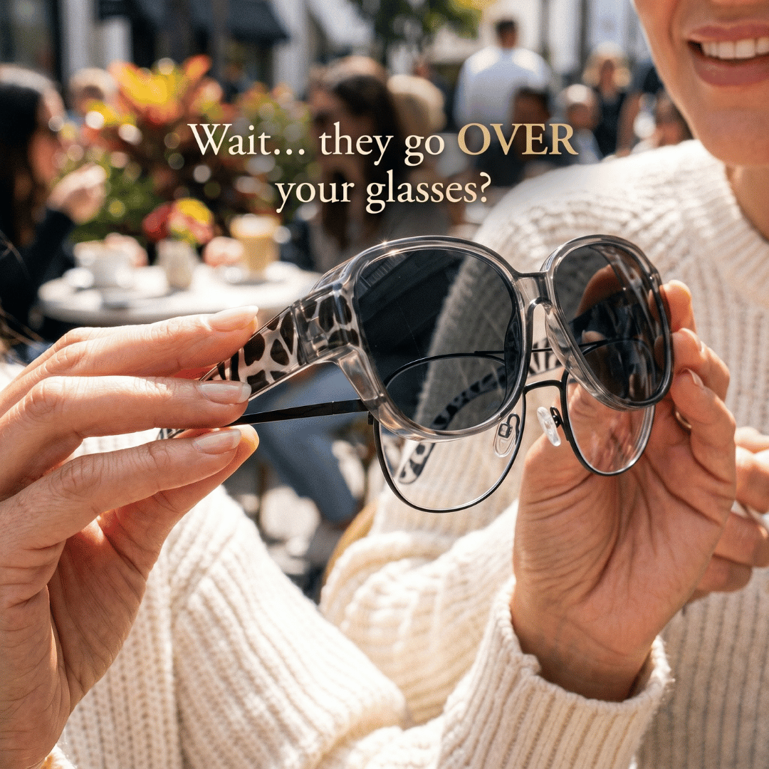 Woman holding HumanWins fit-over sunglasses showing they go over your glasses